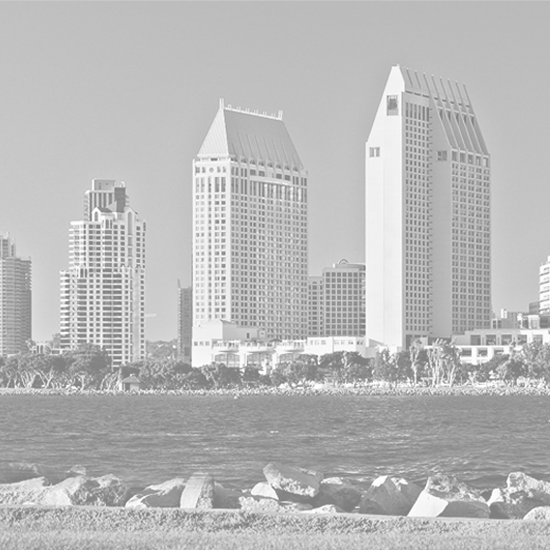 Black and white photograph showing the coast and buildings of San Diego.
